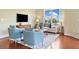 Well-lit living room showcasing hardwood floors, comfortable seating arrangements and large windows at 326 Roswell Se St # 406, Marietta, GA 30060