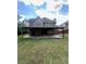 Backyard featuring a large covered deck on a large lot, great for entertaining at 3560 Elinburg Dr, Buford, GA 30519