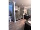 Beautiful bathroom featuring a large glass shower, modern vanities, and decorative accents at 3560 Elinburg Dr, Buford, GA 30519