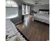 Spacious bedroom with a ceiling fan and large window for natural light at 3560 Elinburg Dr, Buford, GA 30519