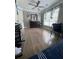 Bedroom featuring wood floors, dresser, ceiling fan, and plenty of natural light at 3560 Elinburg Dr, Buford, GA 30519