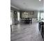 Open-concept dining room showcases tiled floors, modern lighting, and seamless access to outdoor patio at 3560 Elinburg Dr, Buford, GA 30519