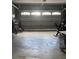 Garage featuring overhead lighting and door, along with some workout equipment at 3560 Elinburg Dr, Buford, GA 30519