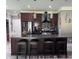 Gourmet kitchen featuring a large island, granite counters, stainless steel appliances, and ample cabinet space at 3560 Elinburg Dr, Buford, GA 30519