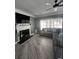 Comfortable living room with tile floors, a fireplace, flat screen television, and a cozy sectional sofa at 3560 Elinburg Dr, Buford, GA 30519