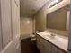 Bathroom with tub/shower, toilet, vanity, and wood-style flooring at 4189 Duncan Ives Dr, Buford, GA 30519