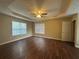 Spacious bedroom with trey ceilings, ceiling fan, and two windows at 4189 Duncan Ives Dr, Buford, GA 30519
