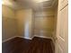 Walk-in closet with wood-style flooring and installed shelving at 4189 Duncan Ives Dr, Buford, GA 30519