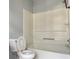 Bathroom features tub/shower combo with toilet, and built in shelves at 795 Abbotts Mill Ct # 73, Johns Creek, GA 30097