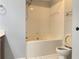 Bright bathroom with a soaking tub and white tiled walls at 795 Abbotts Mill Ct # 73, Johns Creek, GA 30097