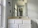 Bathroom featuring a white vanity, sink, mirror, and updated fixtures at 795 Abbotts Mill Ct # 73, Johns Creek, GA 30097