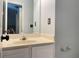 Bathroom featuring a mirror above a vanity with a beige countertop and white cabinets at 795 Abbotts Mill Ct # 73, Johns Creek, GA 30097