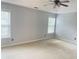 Spacious bedroom features natural light, neutral walls, and a ceiling fan at 795 Abbotts Mill Ct # 73, Johns Creek, GA 30097