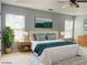 Staged bedroom features a cozy bed, serene artwork, and ample natural light at 795 Abbotts Mill Ct # 73, Johns Creek, GA 30097