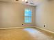 Bedroom with a window, neutral walls, and carpet flooring at 795 Abbotts Mill Ct # 73, Johns Creek, GA 30097