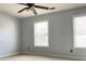 Bedroom features neutral paint, a ceiling fan, and natural lighting at 795 Abbotts Mill Ct # 73, Johns Creek, GA 30097