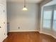 Bright dining area with hardwood floors and a bay window that provides natural light at 795 Abbotts Mill Ct # 73, Johns Creek, GA 30097