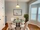 Staged dining area with modern furniture and decor for an inviting atmosphere at 795 Abbotts Mill Ct # 73, Johns Creek, GA 30097