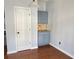Small kitchenette area with blue cabinets, granite countertops, and a cozy atmosphere at 795 Abbotts Mill Ct # 73, Johns Creek, GA 30097