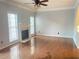 Spacious living room with hardwood floors, a fireplace, large windows and modern finishes at 795 Abbotts Mill Ct # 73, Johns Creek, GA 30097