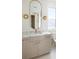 Stylish bathroom featuring a modern vanity, elegant fixtures, and a well-lit mirror at 11560 Serenbe Ln, Chattahoochee Hills, GA 30268