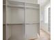 Spacious walk-in closet with custom shelving and ample storage space, ideal for organization at 11560 Serenbe Ln, Chattahoochee Hills, GA 30268