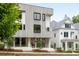 Modern townhome with clean lines, stylish windows, and well-maintained landscaping at 11560 Serenbe Ln, Chattahoochee Hills, GA 30268