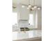 Close-up of a kitchen, featuring marble counters, an island, and modern stainless steel appliances at 11560 Serenbe Ln, Chattahoochee Hills, GA 30268