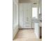 Bright white kitchen features custom cabinets and drawers, perfect for storage at 11560 Serenbe Ln, Chattahoochee Hills, GA 30268
