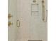 Modern shower with gold fixtures and stone-look tile at 11560 Serenbe Ln, Chattahoochee Hills, GA 30268