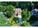 Aerial view of a beautiful home with mature trees and well-manicured lawn at 3245 Bywater Trl, Roswell, GA 30075
