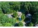 Aerial view of property showcasing lush greenery, mature trees, and neighborhood at 3245 Bywater Trl, Roswell, GA 30075