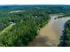 Aerial view of verdant tree lined community near a large river at 3245 Bywater Trl, Roswell, GA 30075