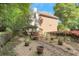 Spacious backyard with manicured landscaping and mature trees at 3245 Bywater Trl, Roswell, GA 30075