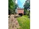 Expansive backyard with lush green grass, hardscape, and beautiful landscaping at 3245 Bywater Trl, Roswell, GA 30075