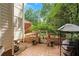 Outdoor patio with lush landscaping and a charming pergola offers a serene setting for outdoor living at 3245 Bywater Trl, Roswell, GA 30075