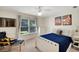Bedroom featuring a comfortable chair, ceiling fan, and bright natural light at 3245 Bywater Trl, Roswell, GA 30075