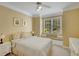 Comfortable bedroom featuring a window seat, neutral walls, and a ceiling fan at 3245 Bywater Trl, Roswell, GA 30075