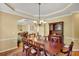 Formal dining room with elegant chandelier and classic traditional furnishings at 3245 Bywater Trl, Roswell, GA 30075