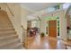 Inviting foyer with hardwood floors, staircase and views into formal dining room at 3245 Bywater Trl, Roswell, GA 30075
