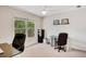 Home office with two desks and natural light from the large window at 3245 Bywater Trl, Roswell, GA 30075