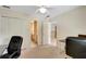Home office featuring a large closet and entrances to the hallway and bathroom at 3245 Bywater Trl, Roswell, GA 30075