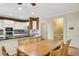 Open-concept kitchen and dining area with modern appliances and white cabinets at 3245 Bywater Trl, Roswell, GA 30075