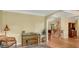 Comfortable sitting room with hardwood flooring, piano, and traditional furnishings at 3245 Bywater Trl, Roswell, GA 30075
