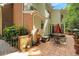 Well-appointed patio features a dining area, lush landscaping, and charming architectural details at 3245 Bywater Trl, Roswell, GA 30075