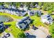 Community aerial view featuring ponds, green lawns, parking lots, and diverse home architecture at 325 Berry Ct, Villa Rica, GA 30180