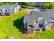 Aerial shot showcasing the community's double balconies, green lawns, and surrounding trees at 325 Berry Ct, Villa Rica, GA 30180