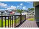 Inviting balcony with a view of the manicured lawn and neighboring homes in this lakeside community at 325 Berry Ct, Villa Rica, GA 30180