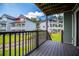 Outdoor balcony space showcasing lawn area and inviting exteriors of the lakeside homes at 325 Berry Ct, Villa Rica, GA 30180
