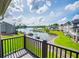Scenic balcony view overlooking the lake, docks, and the beautiful homes of the lakeside community at 325 Berry Ct, Villa Rica, GA 30180